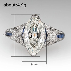 Vintage style marquise cut cubic zirconia ring with blue sapphire accents and silver band