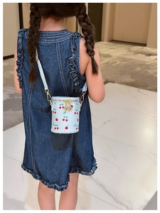 Detail of light blue cherry print bucket bag for girls with metal chain and zipper