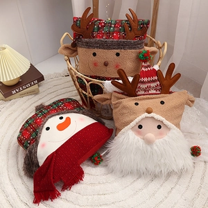 Plush Christmas pillows featuring Santa, snowman, and reindeer on a white rug