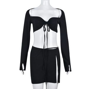 Two-piece black long sleeve crop top and high slit mini skirt set with drawstring detail