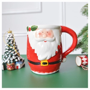 Detail of 3D Santa Claus ceramic mug with hand-painted glaze and festive gift decor
