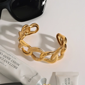 Polished gold stainless steel C-shaped chain cuff bracelet with textured open design