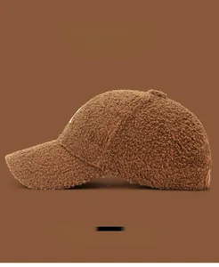 Detail view of brown teddy fleece baseball cap with soft texture and color options