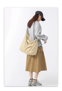 Detailed view of beige corduroy tote bag showing large capacity and soft fabric texture
