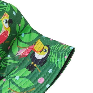 Detail of tropical bucket hat showing toucan print and reinforced brim stitching