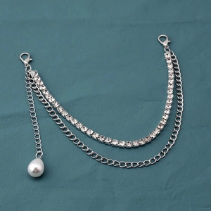 Detail of silver metal bag chain with rhinestones, lobster clasps and pearl pendant