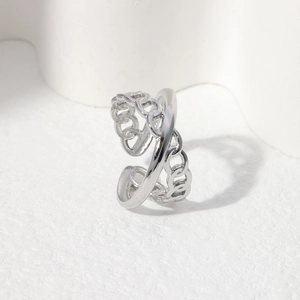 Detail of silver adjustable open ring featuring minimalist cuban chain link design