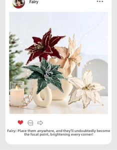 Artificial Christmas velvet poinsettia flowers with glitter edges in a modern vase