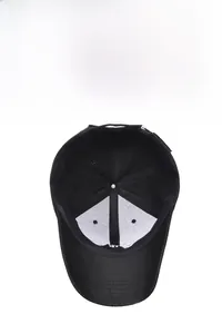 Detail of the black baseball cap interior with white breathable lining and reinforced seams
