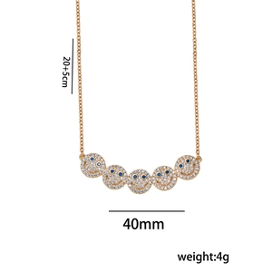 Gold smile necklace with blue and clear gems featuring dimensions and weight labels