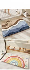 Detail showing plush bathroom mats with thick mountain wave and rainbow heart patterns