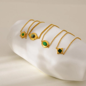 Golden stainless steel necklaces with green gemstone pendants in various geometric shapes