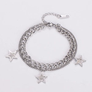 Close-up of double-layered stainless steel bracelet with zircon star charms and lobster clasp