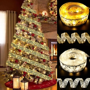 Christmas tree decoration featuring warm gold and silver LED mesh ribbon lights