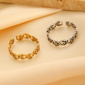 Close-up of adjustable cat paw print open rings in gold and antique silver finishes