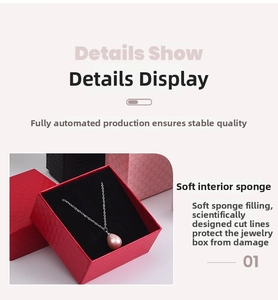 Detail of pink teardrop pendant necklace in red gift box with high-density sponge padding