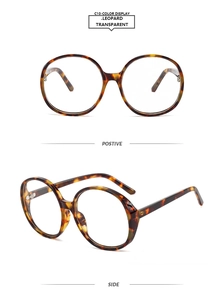 Detail view of round leopard print oversized frames with clear lenses from multiple angles