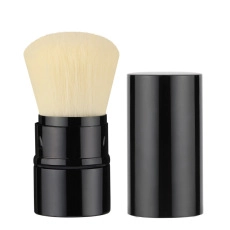 Detailed view of portable retractable makeup brush with black tube and soft white bristles