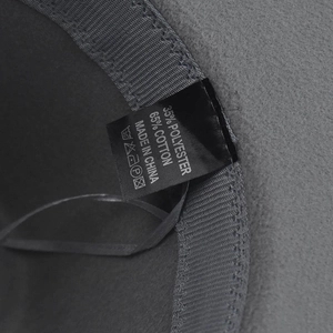 Detail shot of grey wool fedora inner label showing 65% cotton and 35% polyester material