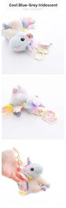 Detail of gradient rainbow plush unicorn keychain with iridescent wings and gold ring
