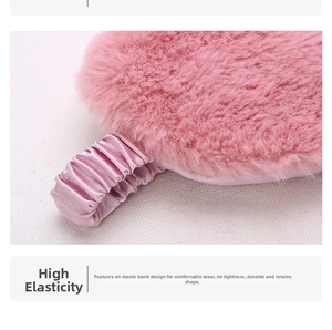 Detail of pink plush sleep mask showing the elastic strap and soft faux silk edges