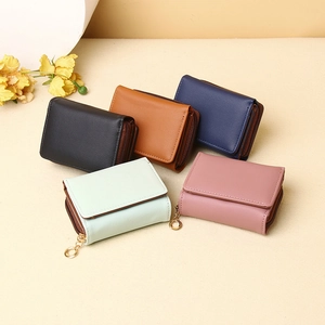 Women's minimalist tri-fold short wallets in five colors with circular zip puller