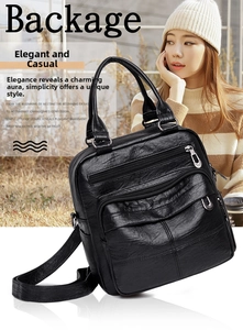 Detail of a black faux leather multi-pocket backpack featuring silver zippers on grass