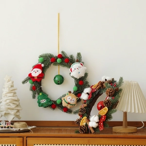 Festive Christmas wreaths with Santa and reindeer plush decor for holiday door hanging