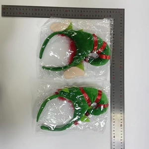 Détails des serre-têtes de lutin de Noël avec chapeaux rayés verts et cloches rouges