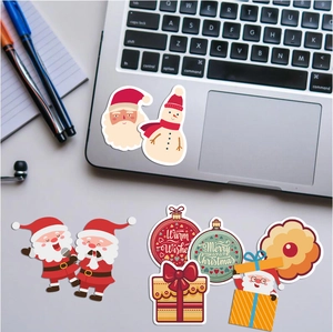 Waterproof Christmas stickers with Santa and snowmen motifs on a laptop lid