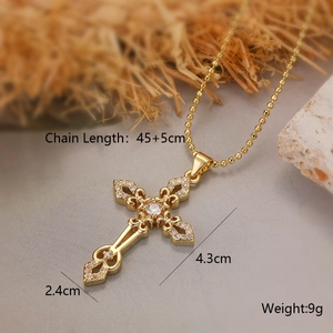 Detailed close-up of gold-plated cross pendant with zirconia on bead chain, size 4.3x2.4cm