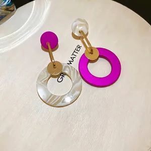 Artistic asymmetric gold-plated earrings with purple and white marble resin circles