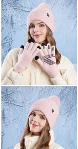 Pink winter knit set featuring touch-screen gloves and a beanie with a faux fur pompom