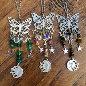 Detailed silver butterfly suncatchers with crystal beads and celestial sun moon charms