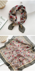 Detail of floral linen square scarf with dark green border and vintage pattern design