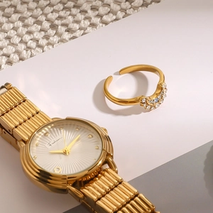Elegant 18k gold stainless steel ring with micro-paved crystals and matching metal watch