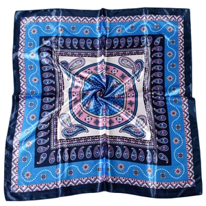 Detail view of square satin scarf featuring intricate blue and pink paisley patterns