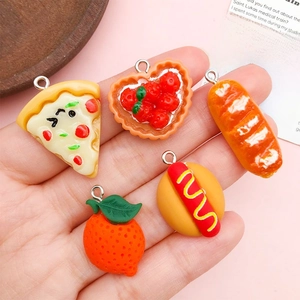 Detail of five miniature food resin charms including pizza and hotdog with metal rings
