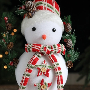 Christmas white flocked snowman ornament with red and green plaid scarf and pine cone