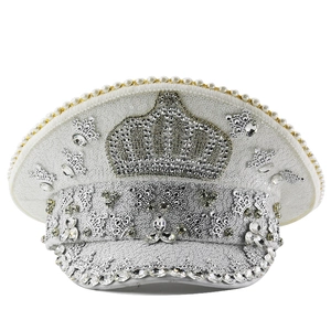Detail of white captain hat with silver rhinestones, sequins and crown emblem for parties
