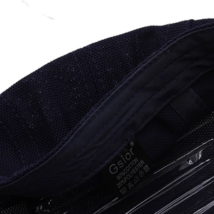 Detail view of cotton blend inner fabric and care label on the navy blue mesh cap