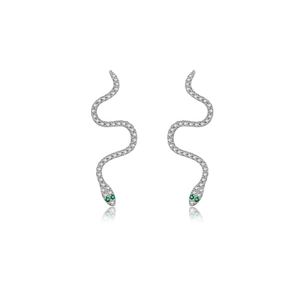 Detail of silver snake stud earrings with white zirconia stones and green gem eyes