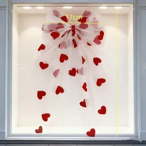 Detail of white mesh bow hair clip with red hearts, measuring 17cm by 30cm size