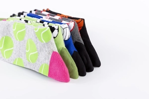 Detail view of multi-color cotton sports socks with jacquard athletic ball patterns