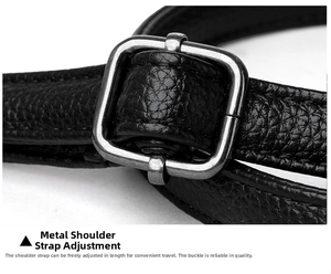 Detail of silver-grey metal buckle on black lychee grain leather shoulder strap