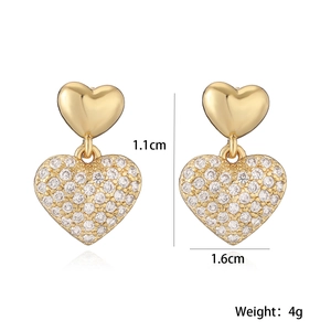 Elegant gold plated heart drop earrings with shimmering zircon pavé and light reflections