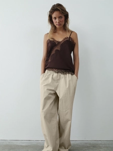 Women's chic wide-leg trousers in beige with dark brown lace trim satin camisole top
