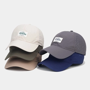 Detailed view of quick-dry baseball caps with breathable mesh side panels in five colors