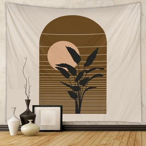 Detail view of Boho tapestry with sun and leaf motifs in a minimalist home setting