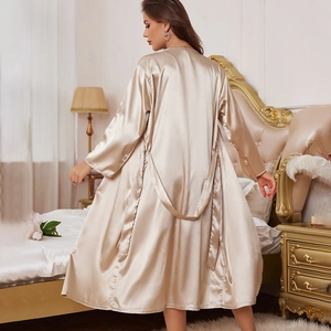 Elegant champagne gold satin long bathrobe with belt shown from a back view in bedroom